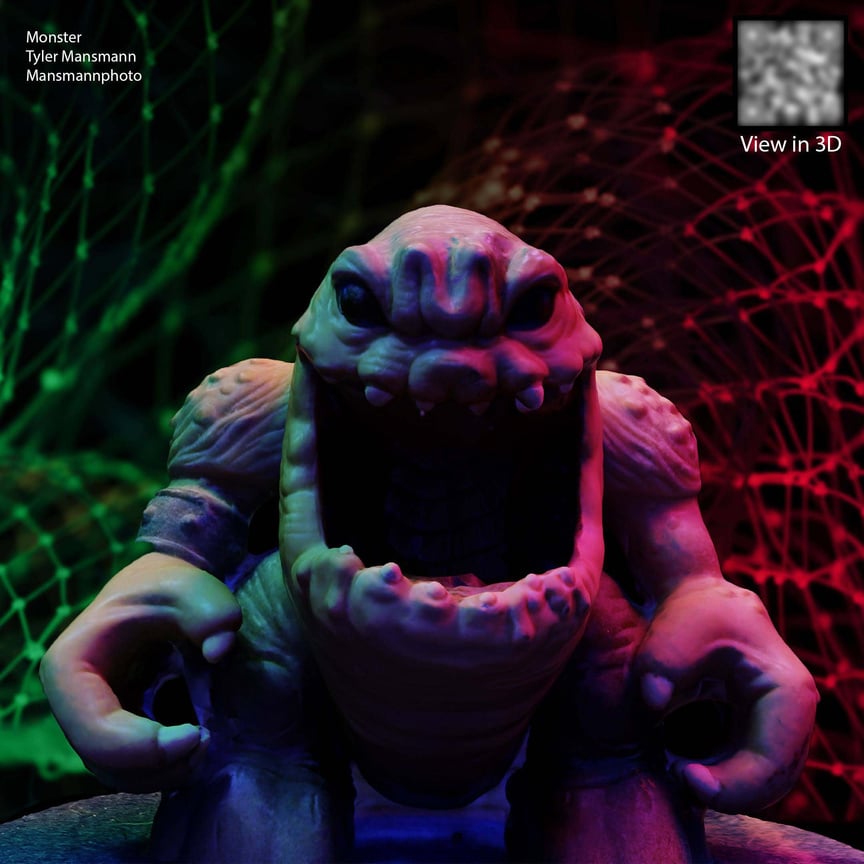 a figurine of a monster with its mouth open